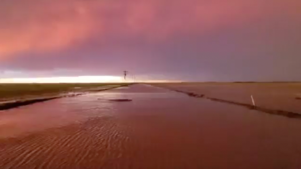 Flooding in Texas Amid Pink Sunset and Rainbow WeatherBug