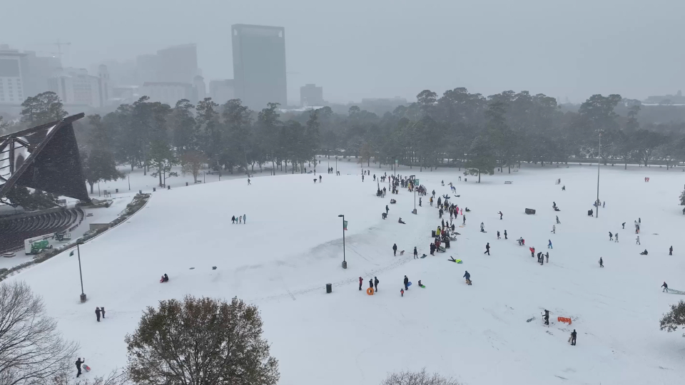 Sledders Enjoy Rare Snow in Houston | WeatherBug